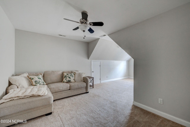 carpeted living room with ceiling fan