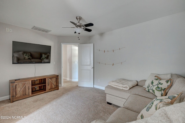 living room featuring carpet and ceiling fan