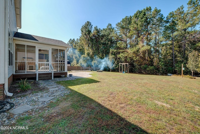 view of yard with a sunroom