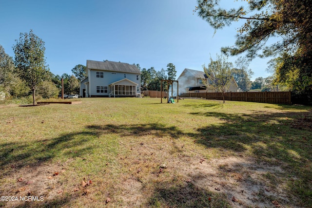 view of yard featuring a sunroom