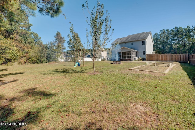 view of yard featuring a sunroom