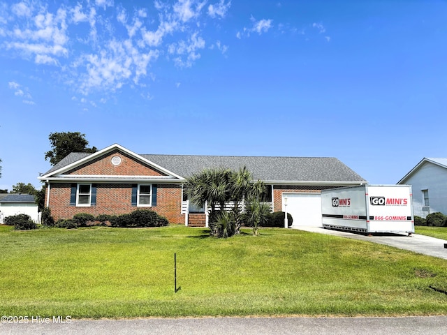 117 Buds Ln, Cedar Point, NC 28584 - single story home with driveway, brick siding, an attached garage, and a front lawn