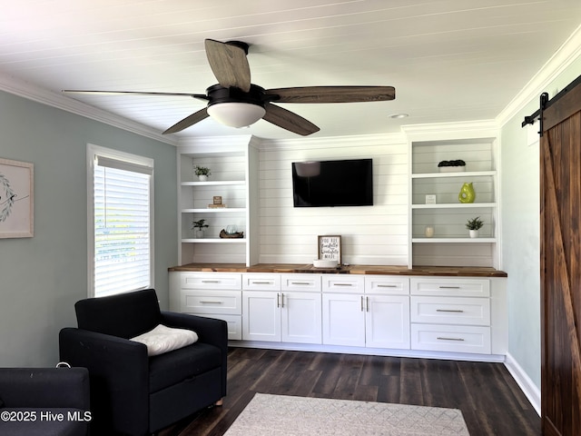 117 Buds Ln, Cedar Point, NC 28584 - living area featuring a barn door, ornamental molding, dark wood-style floors, and a ceiling fan