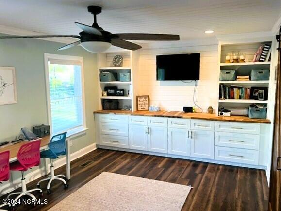 bar with butcher block countertops, white cabinetry, and dark hardwood / wood-style floors