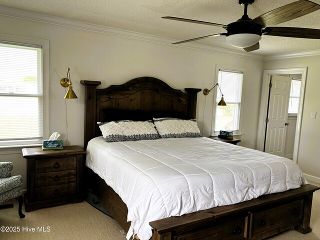 117 Buds Ln, Cedar Point, NC 28584 - bedroom featuring a textured ceiling, ornamental molding, light colored carpet, multiple windows, and ceiling fan