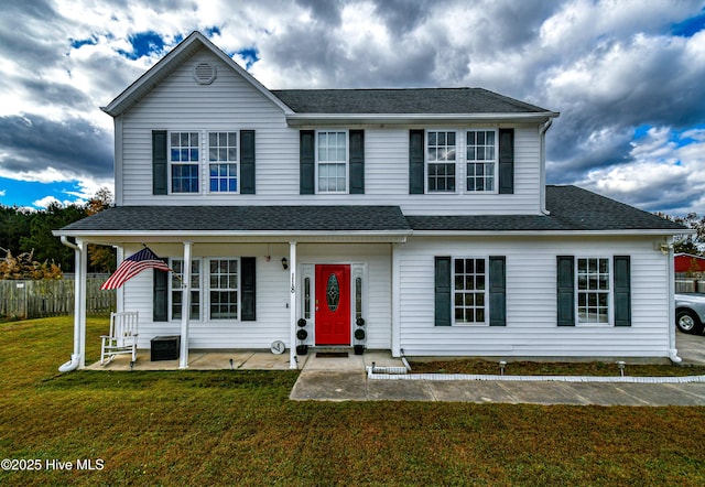 view of front of property featuring a patio and a front yard