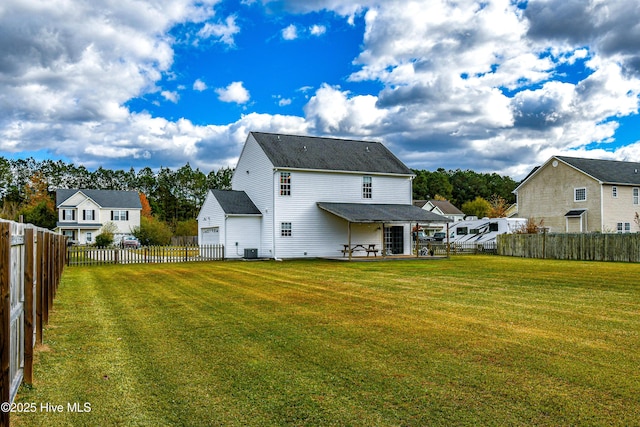 back of property featuring central AC, a lawn, and a patio