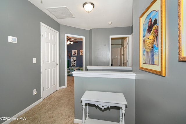 hallway with carpet flooring