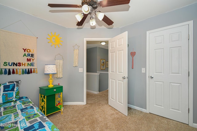 bedroom with ceiling fan and carpet floors