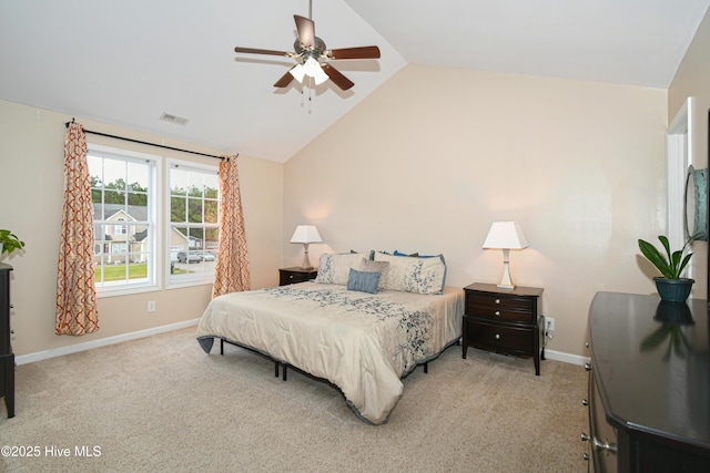 bedroom featuring light colored carpet, vaulted ceiling, and ceiling fan