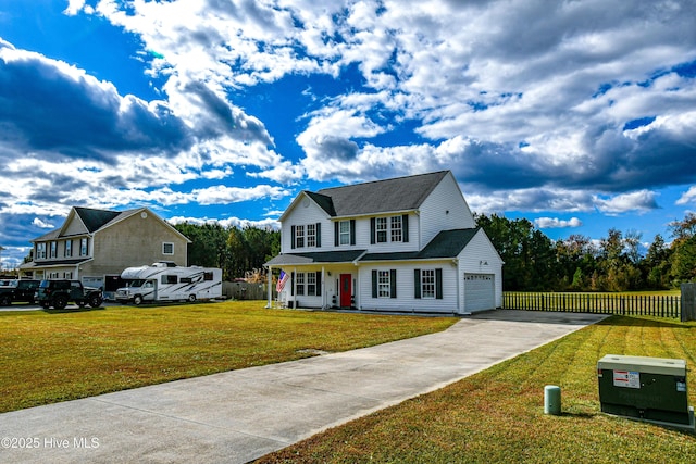 view of front of property with a garage and a front lawn