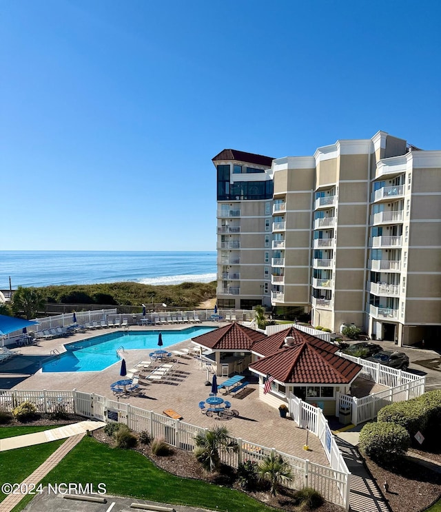 view of pool with a water view