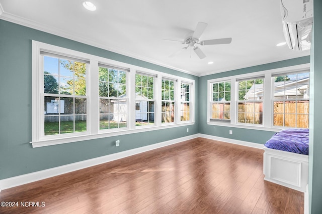 unfurnished sunroom with ceiling fan and a healthy amount of sunlight