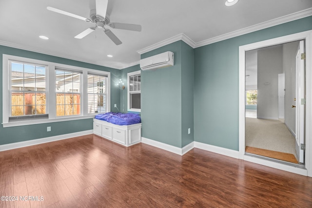 unfurnished bedroom featuring ornamental molding, a wall mounted AC, hardwood / wood-style flooring, and ceiling fan