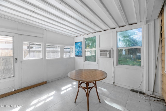 sunroom / solarium featuring cooling unit and lofted ceiling