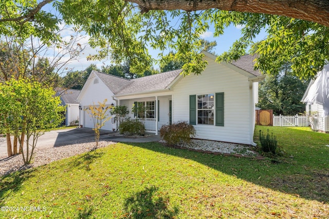 view of front facade with a garage and a front lawn