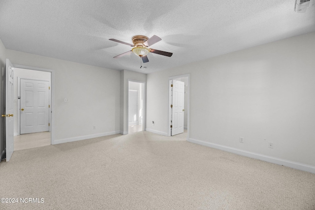 unfurnished room with a textured ceiling and ceiling fan