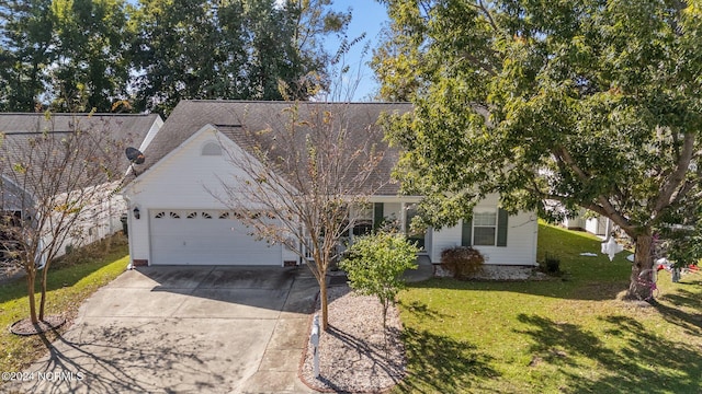 view of front of home featuring a front lawn and a garage