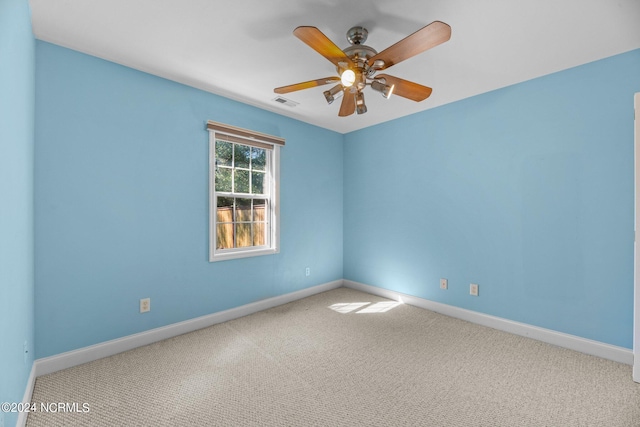 carpeted empty room with ceiling fan