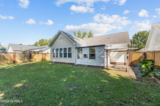 back of house with a yard