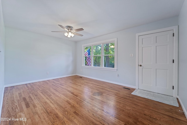 spare room featuring ceiling fan and hardwood / wood-style floors