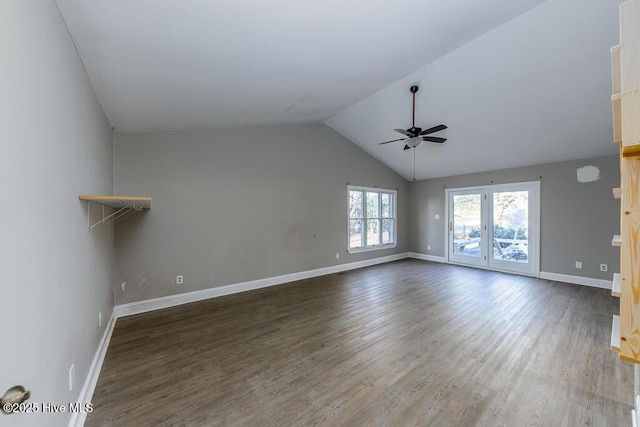 spare room with vaulted ceiling, ceiling fan, and dark wood-type flooring