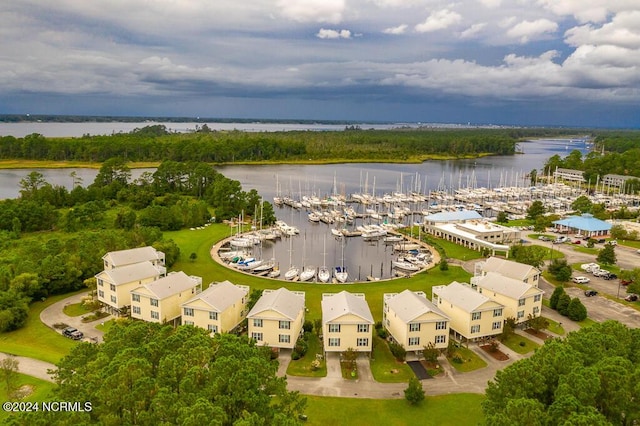 birds eye view of property with a water view