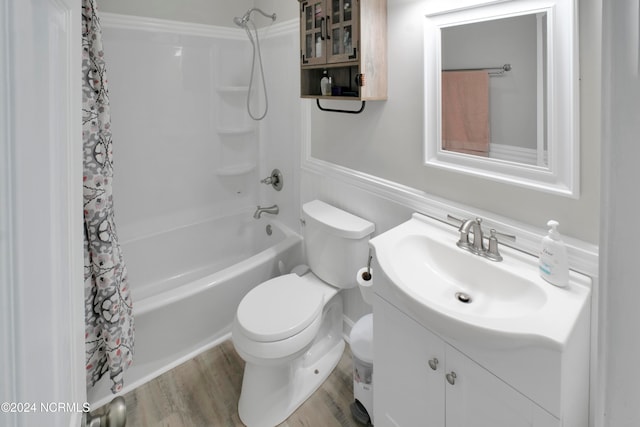 full bathroom with vanity, hardwood / wood-style floors, shower / tub combo, and toilet