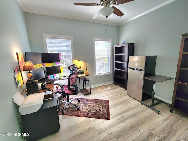 office space with ornamental molding, ceiling fan, and light wood-type flooring