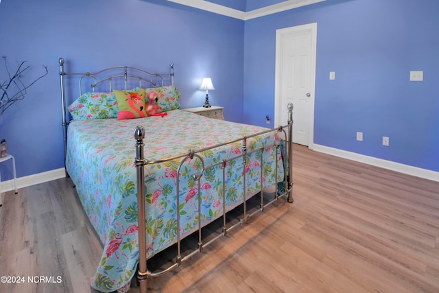 bedroom with wood-type flooring