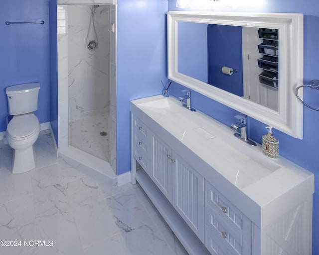 bathroom featuring tiled shower, vanity, and toilet