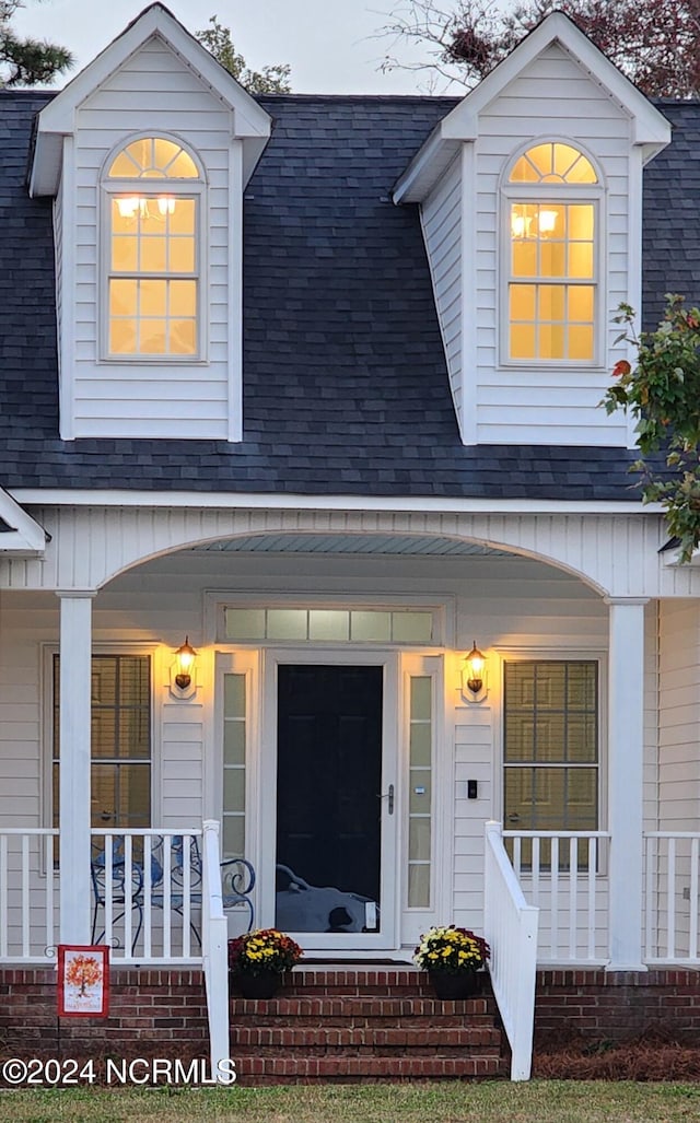 view of front of home featuring covered porch