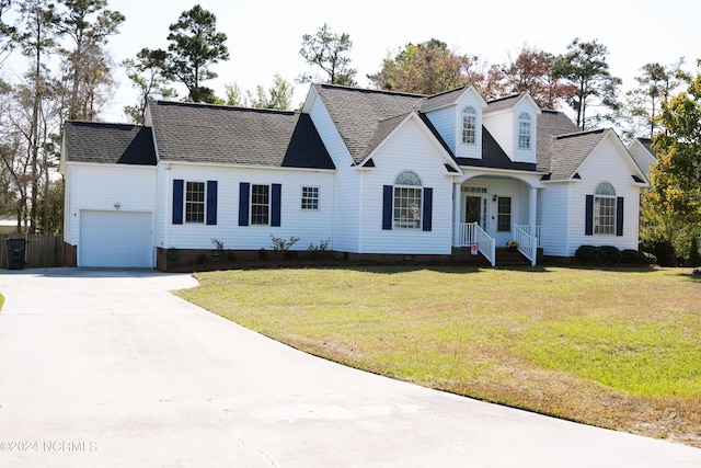 cape cod-style house with a garage and a front yard