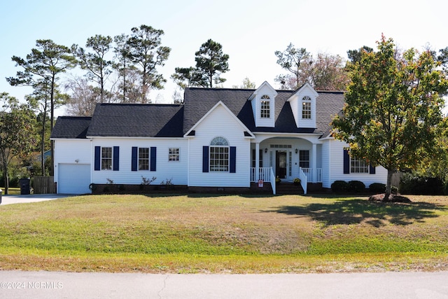 cape cod home with a garage and a front yard