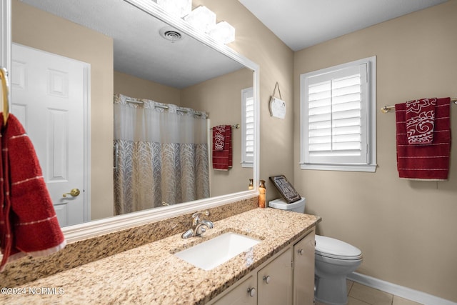 bathroom featuring toilet, tile patterned floors, vanity, visible vents, and a shower with curtain