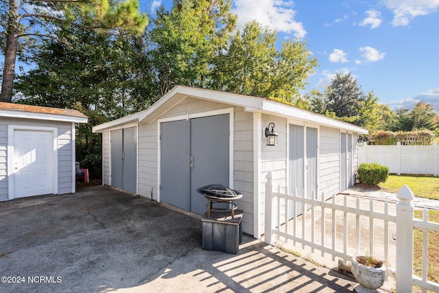 view of shed with fence