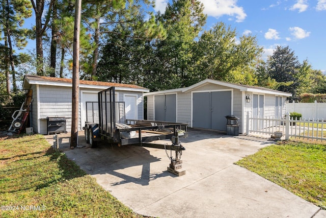 view of shed with fence