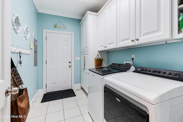 laundry room with cabinets, ornamental molding, light tile patterned floors, and separate washer and dryer