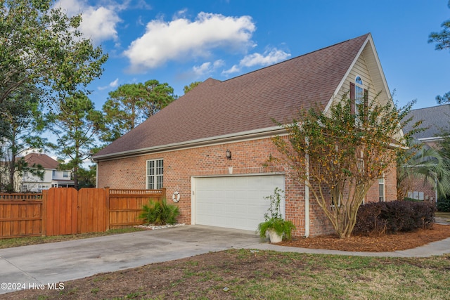 view of property exterior featuring a garage