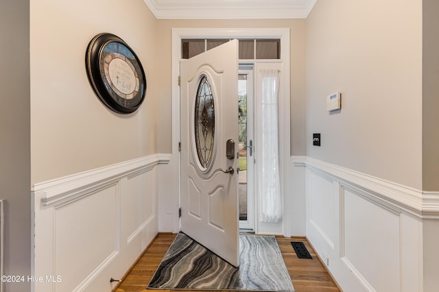 foyer featuring light hardwood / wood-style floors and ornamental molding