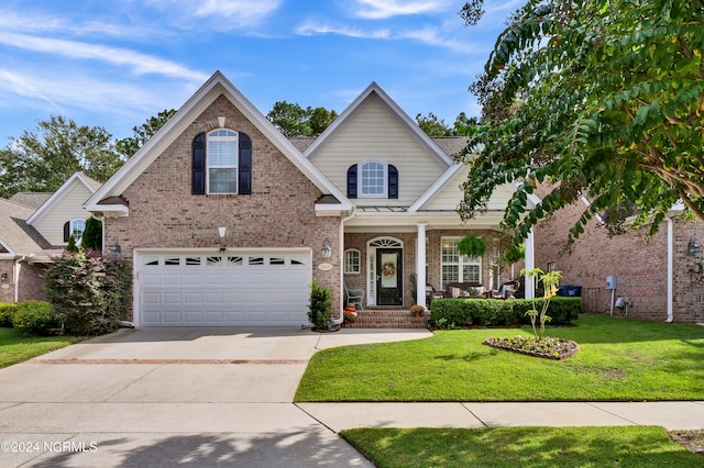 view of front of property with a front lawn and a garage