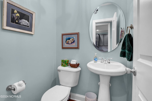 bathroom featuring toilet