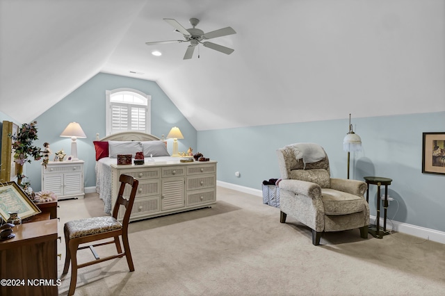 carpeted bedroom with ceiling fan and vaulted ceiling