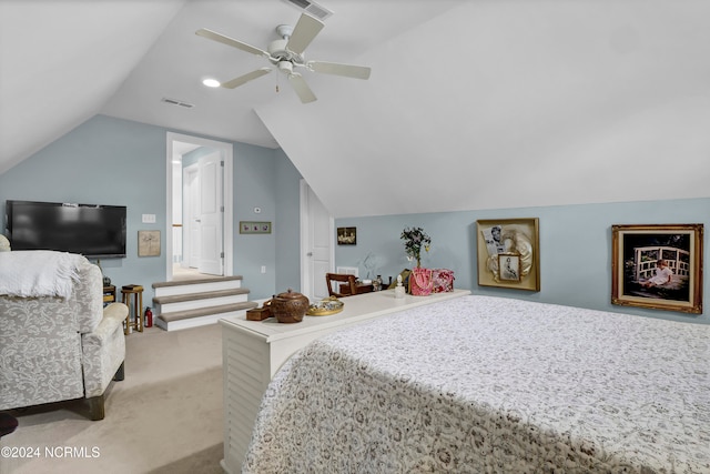 carpeted bedroom featuring vaulted ceiling and ceiling fan