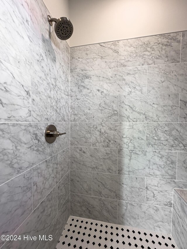 bathroom with tiled shower