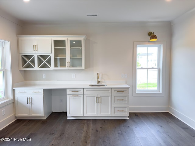 kitchen featuring white cabinetry, sink, and dark hardwood / wood-style floors