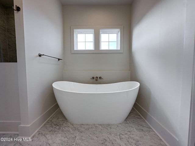 bathroom featuring a bath