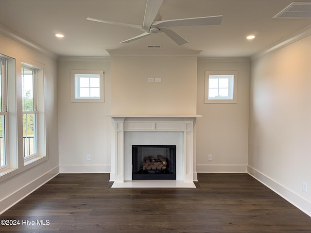 unfurnished living room with dark hardwood / wood-style floors, ceiling fan, crown molding, and a wealth of natural light