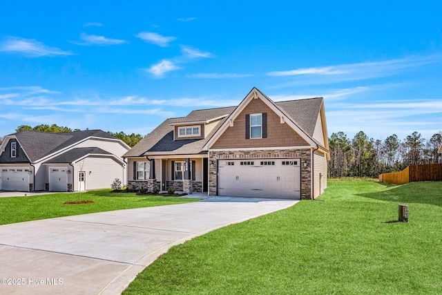 view of front of house featuring a shingled roof, fence, concrete driveway, stone siding, and a front yard