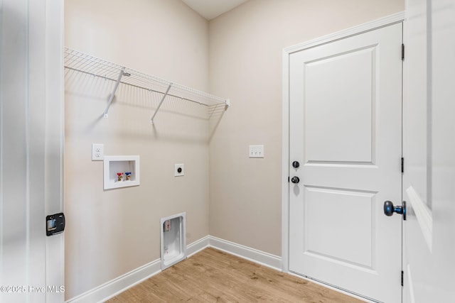 laundry room with washer hookup, light wood finished floors, electric dryer hookup, laundry area, and baseboards